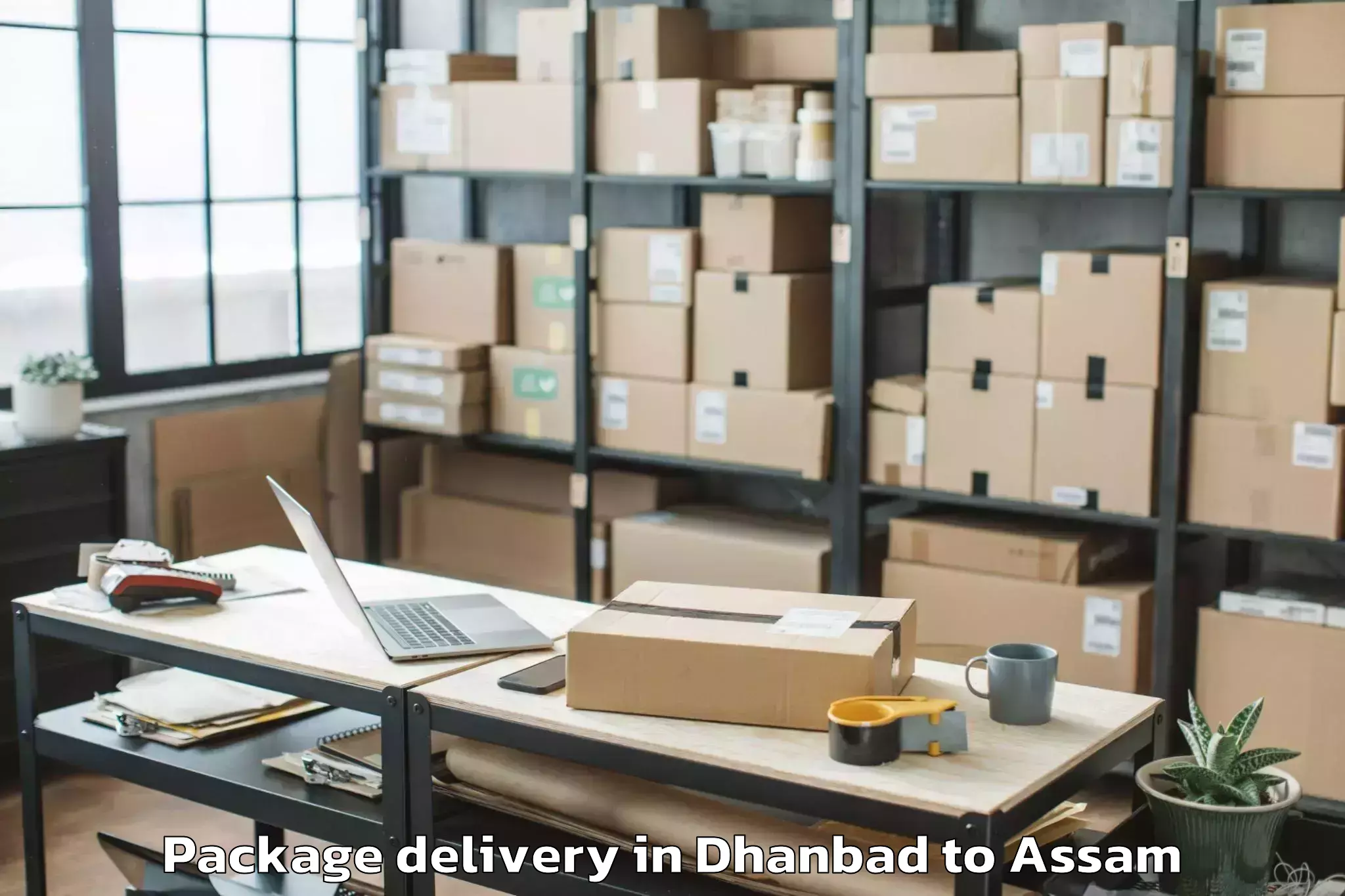 Trusted Dhanbad to Basugaon Package Delivery